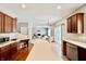 Spacious kitchen with stainless steel appliances, hardwood floors, and an open view to the living area at 12044 Bird Key Blvd, Fishers, IN 46037
