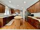 Spacious kitchen with hardwood floors, wood cabinets, stainless steel appliances, and center island at 12044 Bird Key Blvd, Fishers, IN 46037