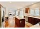 Well-lit kitchen featuring stainless steel appliances, cherry cabinets, and hardwood floors at 12044 Bird Key Blvd, Fishers, IN 46037