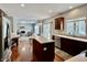 Open-concept kitchen with a center island, stainless steel appliances, and hardwood floors throughout at 12044 Bird Key Blvd, Fishers, IN 46037