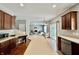 Open-concept kitchen with a center island, stainless steel appliances, and hardwood floors throughout at 12044 Bird Key Blvd, Fishers, IN 46037