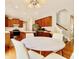 Kitchen and dining area featuring hardwood floors, stainless steel appliances, and plenty of natural light at 12044 Bird Key Blvd, Fishers, IN 46037