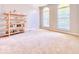 Bright, open living room with neutral carpet and large windows at 12044 Bird Key Blvd, Fishers, IN 46037