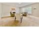 Bright living room with a fireplace, neutral tones, and comfortable seating with large window views at 12044 Bird Key Blvd, Fishers, IN 46037