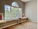 Bright loft area with a large window, window seat, neutral paint, and carpet at 12044 Bird Key Blvd, Fishers, IN 46037