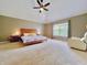 Large main bedroom with ceiling fan and window at 12044 Bird Key Blvd, Fishers, IN 46037