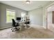 This carpeted office is sunlit with two large work stations with updated computer systems at 12044 Bird Key Blvd, Fishers, IN 46037