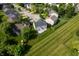 Expansive aerial view of the home with a large, well-maintained yard and a private backyard concrete patio at 12331 Chiseled Stone Dr, Fishers, IN 46037