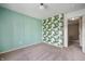 Charming bedroom with bright wallpapered wall, neutral walls, and plush carpet at 12331 Chiseled Stone Dr, Fishers, IN 46037