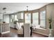 Bright kitchen features white cabinets, stainless steel appliances, and a dining area with a window seat at 12331 Chiseled Stone Dr, Fishers, IN 46037