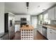 Charming kitchen featuring white cabinets, stainless steel appliances, a butcher block island, and granite counters at 12331 Chiseled Stone Dr, Fishers, IN 46037