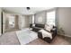 Comfortable living room features a sectional sofa, a plush rug, neutral colors, and soft lighting at 12331 Chiseled Stone Dr, Fishers, IN 46037
