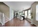Bright open floorplan with modern kitchen, dining area, and hardwood floors at 12331 Chiseled Stone Dr, Fishers, IN 46037