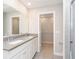 Bathroom featuring double sink, walk-in closet, and ceramic tile floors at 1237 Langham St, Avon, IN 46123