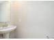 Bathroom with white pedestal sink and hardware awaiting final installation at 1237 Langham St, Avon, IN 46123