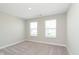 Bedroom with carpet flooring and 2 windows at 1237 Langham St, Avon, IN 46123