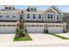 Townhouse featuring a two-car garage and a well maintained lawn at 1237 Langham St, Avon, IN 46123