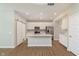Bright kitchen with stainless steel appliances, an island, and ample white cabinets at 1237 Langham St, Avon, IN 46123