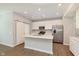Bright kitchen featuring an island with sink, stainless steel appliances, and ample cabinets at 1237 Langham St, Avon, IN 46123