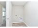 Compact laundry room area with connections and vinyl floor at 1237 Langham St, Avon, IN 46123