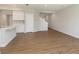 Spacious living room with wood flooring and a view into the modern kitchen and staircase at 1237 Langham St, Avon, IN 46123