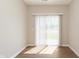 A bright room is naturally illuminated by sliding glass doors to the outside at 1237 Langham St, Avon, IN 46123