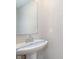 Bathroom features a pedestal sink and modern fixtures at 1280 Newton St, Avon, IN 46123