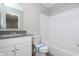Bathroom with vanity, toilet, and a bathtub with white subway tile surround at 1280 Newton St, Avon, IN 46123
