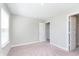 A bright bedroom features neutral walls, carpeted floors, and a window at 1280 Newton St, Avon, IN 46123