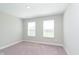 Bedroom with neutral carpet and two windows allowing natural light at 1280 Newton St, Avon, IN 46123