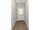 Clean, bright entryway featuring wood-look flooring and a door with a window for natural light at 1280 Newton St, Avon, IN 46123