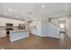 Open kitchen with stainless appliances, an island featuring a sink, and access to the living area at 1280 Newton St, Avon, IN 46123