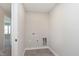 A basic laundry room includes hookups and a tile floor at 1280 Newton St, Avon, IN 46123