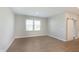 Bright living room with stylish flooring, a barn door feature, and large windows at 1280 Newton St, Avon, IN 46123