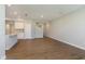 Spacious living area with sleek flooring, open layout, and staircase access to upper levels at 1280 Newton St, Avon, IN 46123