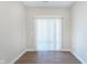 Bright room with wood floors and sliding glass door to a patio at 1280 Newton St, Avon, IN 46123