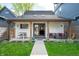 Charming backyard featuring a covered patio with an outdoor dining area and lounge seating at 1310 Olive St, Indianapolis, IN 46203