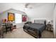 Bedroom featuring a bed, desk, and memorabilia, with a ceiling fan and plenty of natural light at 1310 Olive St, Indianapolis, IN 46203