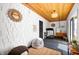 Bright bonus room with a wood plank ceiling, stylish decor, and comfortable seating, ideal for relaxing at 1310 Olive St, Indianapolis, IN 46203