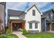 Charming two-story home with a welcoming front porch and beautifully landscaped front yard at 1310 Olive St, Indianapolis, IN 46203