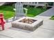 Close-up of a modern fire pit with comfortable seating, creating a cozy outdoor gathering space at 1310 Olive St, Indianapolis, IN 46203
