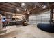 Spacious garage with ample storage, a seating area, and a finished interior, perfect for a workshop or recreation at 1310 Olive St, Indianapolis, IN 46203