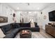 Bright and airy living room featuring stylish decor and an open layout to the kitchen at 1310 Olive St, Indianapolis, IN 46203