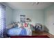 This bedroom features a daybed, artwork, and a comfortable chair at 13244 Snow Owl Dr, Carmel, IN 46033