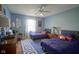 Cozy bedroom with twin beds, blue walls, and playful decorations at 13244 Snow Owl Dr, Carmel, IN 46033