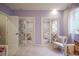 Light purple bedroom featuring charming decor, and a view of the front yard at 13244 Snow Owl Dr, Carmel, IN 46033