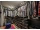 Well-organized walk-in closet with ample storage, shelving, and convenient drawer systems at 13244 Snow Owl Dr, Carmel, IN 46033