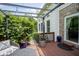 Relaxing deck space with a covered seating area and a view of the landscaped yard at 13244 Snow Owl Dr, Carmel, IN 46033