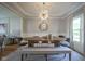 Bright dining room featuring a modern chandelier, large wood table and stylish decor at 13244 Snow Owl Dr, Carmel, IN 46033