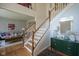Elegant foyer with a staircase, hardwood floors, and view into the living room at 13244 Snow Owl Dr, Carmel, IN 46033